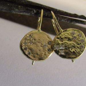 Gold diamonds earrings.